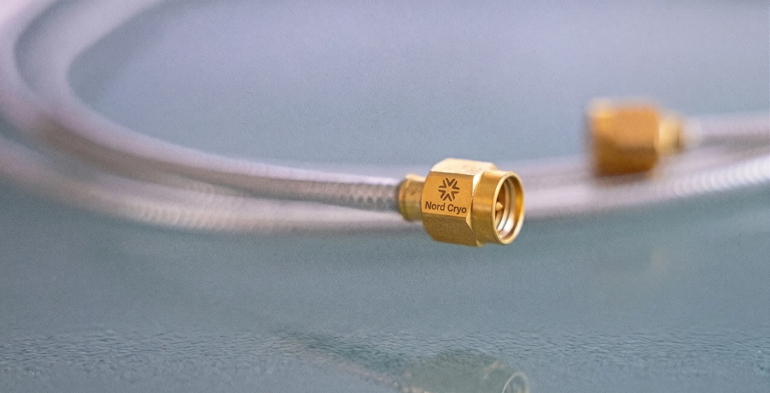 Cryogenic low-thermal-conductivity coaxial cables